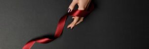 red ribbon on woman's hand the ribbon is free