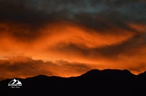 red clouds sunset over mountain range