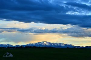 Pikes Peak with a blue hue and setting sun