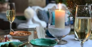 candle burning peaceful table setting