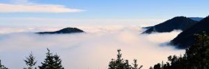 mountain peaks above the clouds altitude sickness