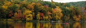 september scene of changing tree colors on a lake